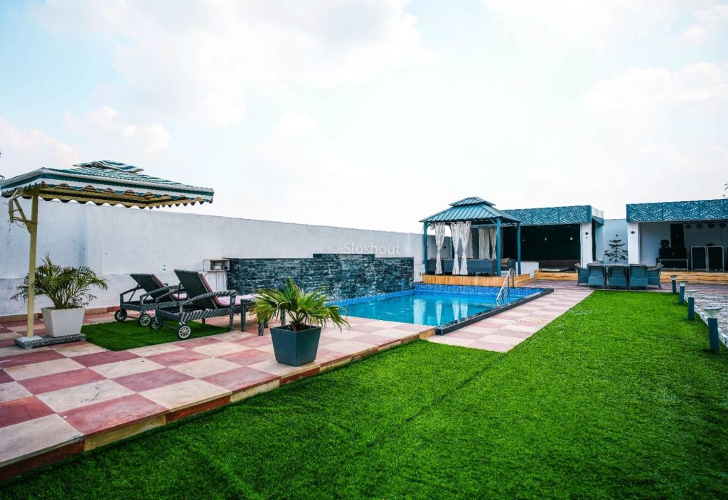 Hridhya Farms pool with lawn